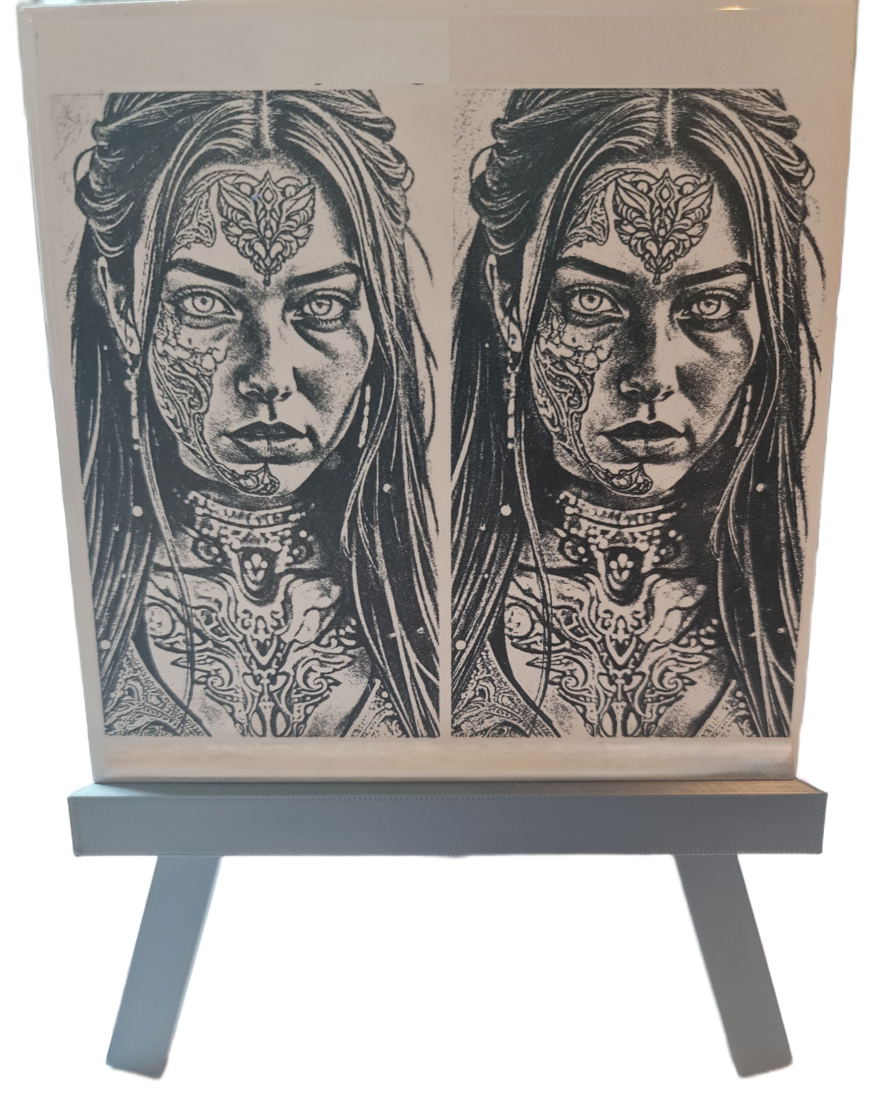 Black and white tattoo-style portrait prints of a woman displayed on an easel, Acier Manufacturing Limited