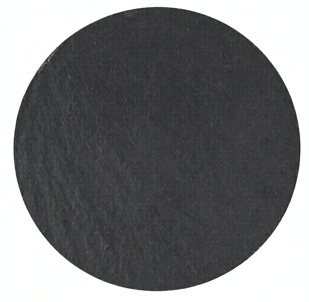 Contemporary round black slate coaster by Acier Manufacturing Limited on white background