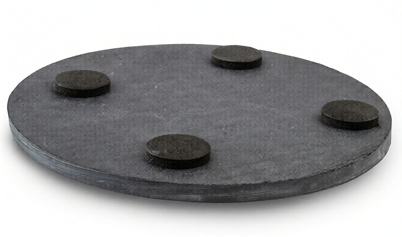 Round industrial black coaster with four raised pads, Acier Manufacturing Limited product