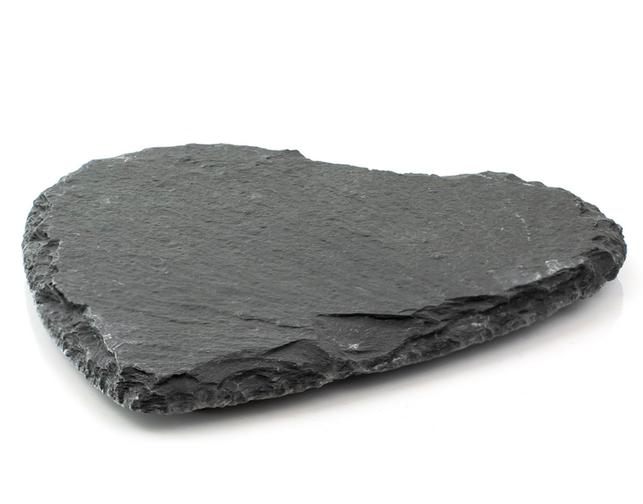 Natural heart-shaped dark stone coaster on white background, Acier Manufacturing Limited