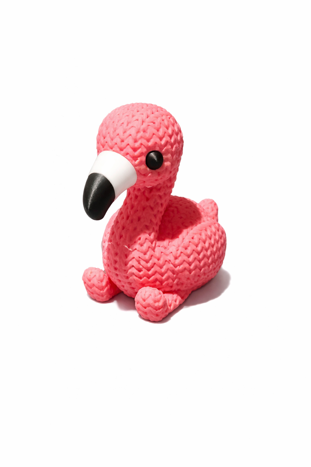 Pink flamingo toy with textured surface on white background, Acier Manufacturing Limited