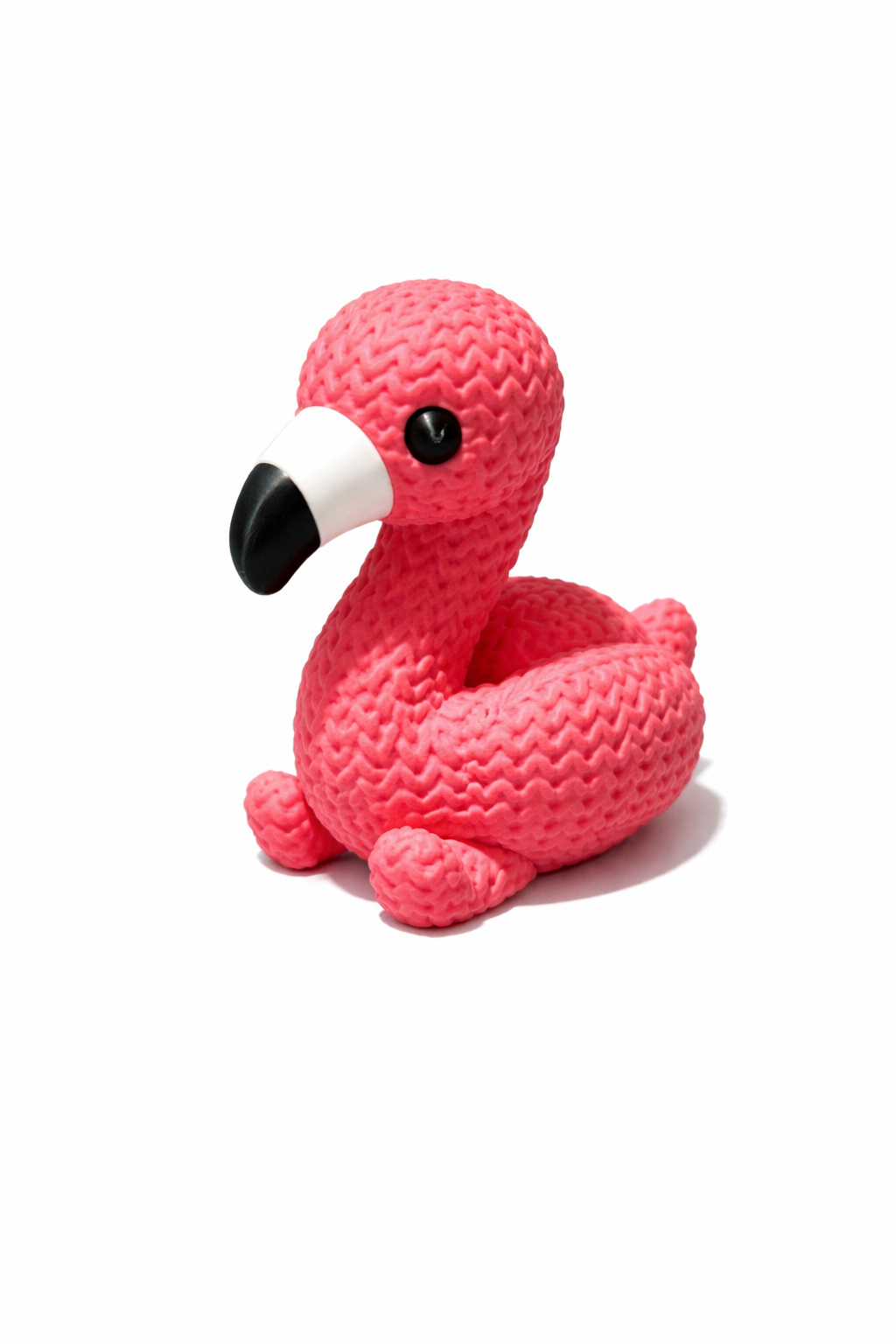 Pink flamingo toy with textured surface on white background, Acier Manufacturing Limited