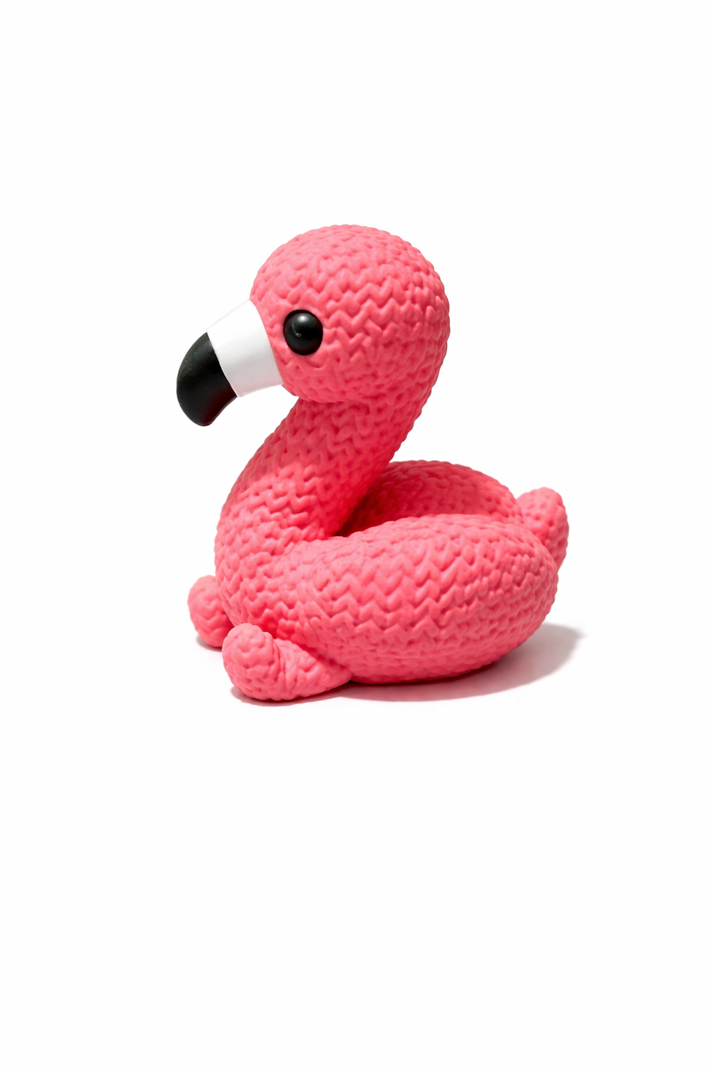 Pink textured flamingo toy figure on white background, Acier Manufacturing Limited